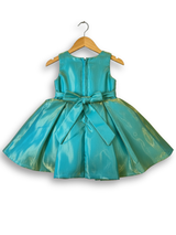 Lime green girls' flared frock (mini anarkali) on a hanger, featuring a yellow/green floral print and heavy gold embroidery around the neckline.