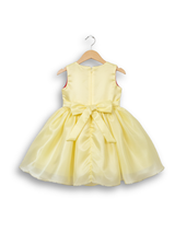 Pale yellow sleeveless girls' party frock on a hanger, featuring a shimmering, full skirt, a silver waistband, and two large yellow flower appliqués with white butterflies on the chest.