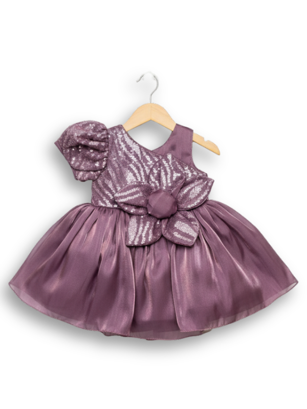 Mauve girls' one-shoulder party frock on a hanger, featuring a puff sleeve, a silver sequin zebra-print bodice, a large mauve flower, and a voluminous satin skirt.