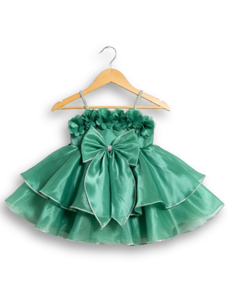 Teal green girls' sleeveless party frock on a hanger, featuring a shimmering pleated skirt and two large flower appliqués made from gold cord on the bodice.