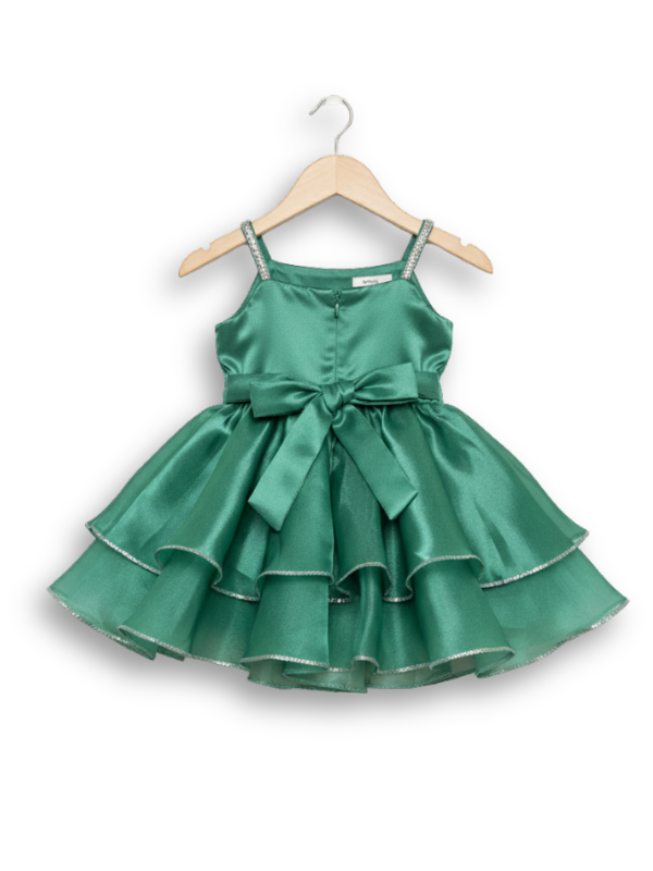 Teal green girls' sleeveless party frock on a hanger, featuring a shimmering pleated skirt and two large flower appliqués made from gold cord on the bodice.