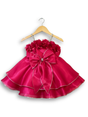 Hot rani pink girls' party frock on a hanger, featuring rhinestone straps, 3D flowers on the neckline, a large satin bow, and a full, tiered skirt with silver trim.