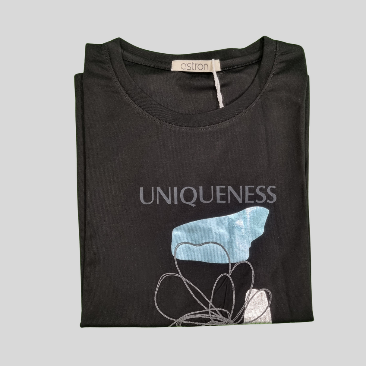Girl's Graphic T-Shirt – “UNIQUENESS” Artistic Inspirational Print