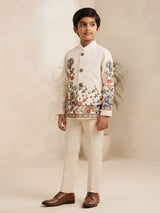 Boys wearing a cream printed jacket with mandarin collar and matching trousers
