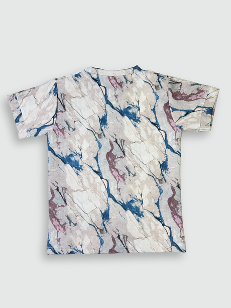 Boys' short-sleeve T-shirt featuring a cream, blue, and maroon marble-like print with the black text 'ULTIMATE' across the chest.